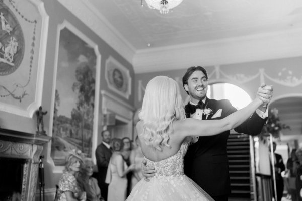 Black and white bride and groom dancing