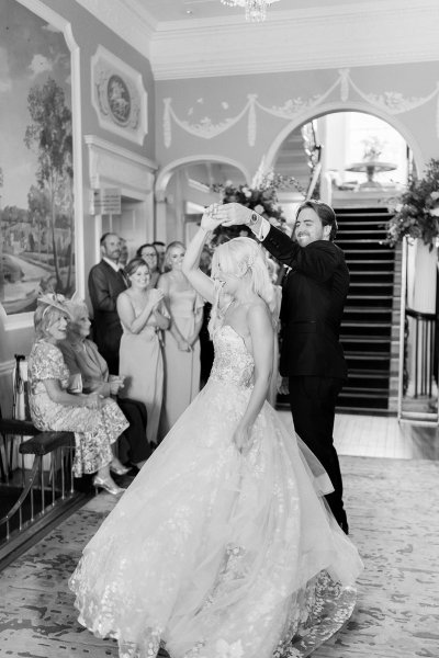 Black and white bride and groom dancing