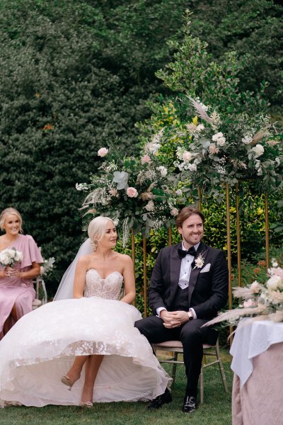 Bride and groom seated during ceremony