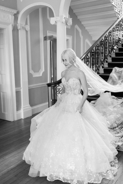 Bride approaches groom black and white