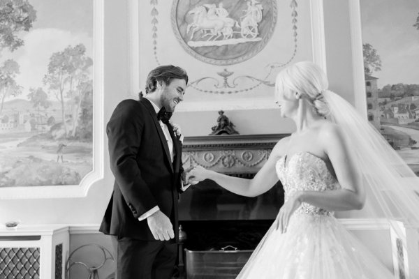 Bride approaches groom black and white