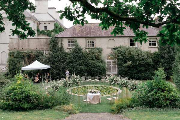 Empty ceremonial seating area display flowers wedding venue