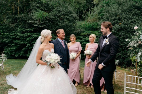 Bride groom and father bridesmaids