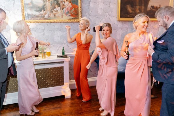 Bridesmaids and family/guests dancing