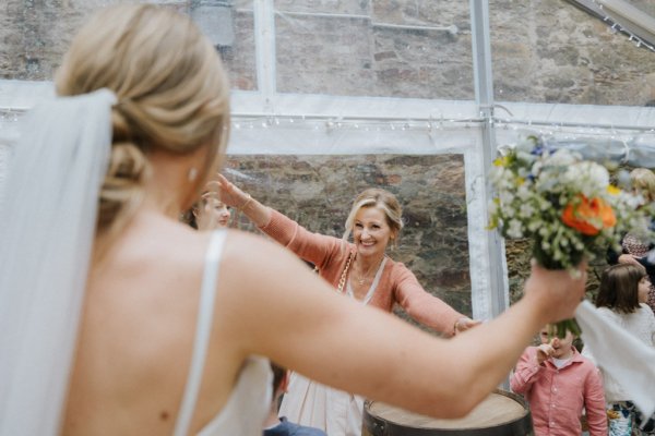 Bride hugging mother/bridesmaid