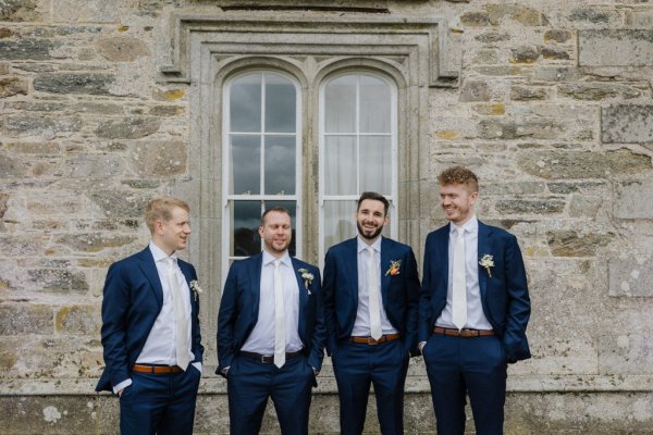 Groom and groomsmen exterior shot