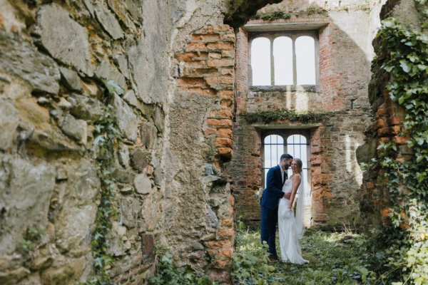 Couple kiss kissing in old ruin