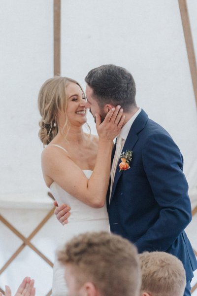 Bride and groom go in for a kiss