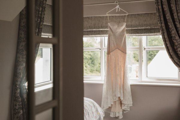 Hanging dress at window