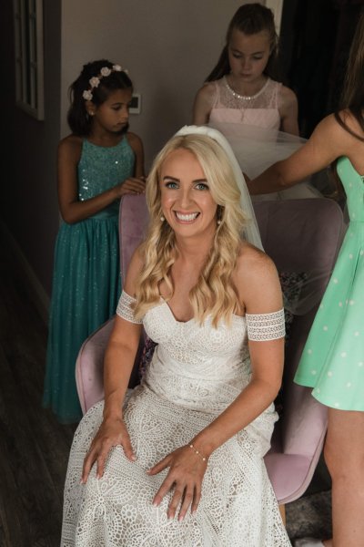 Bride sitting smiling to camera