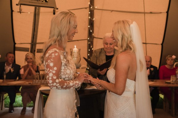 Bride and bride officiant at alter