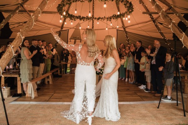 Family picture children marquee guests bride and bride