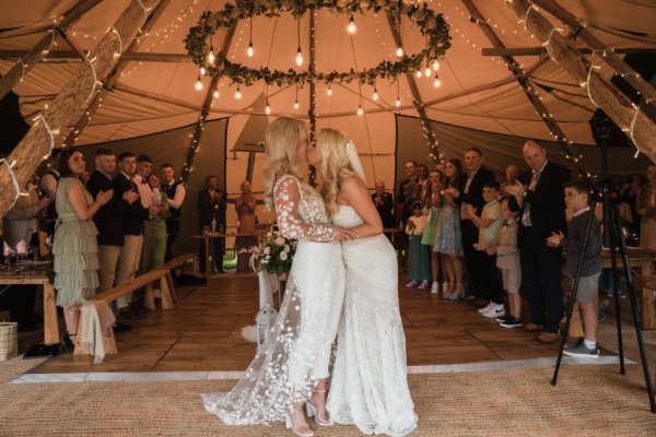 Family picture children marquee guests bride and bride