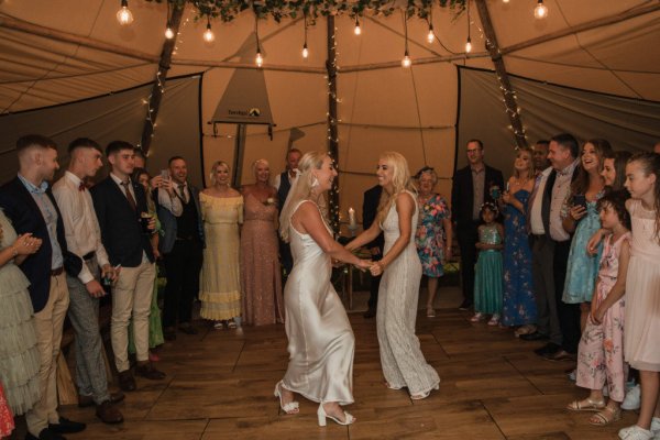 Bride and bride dancing dancefloor