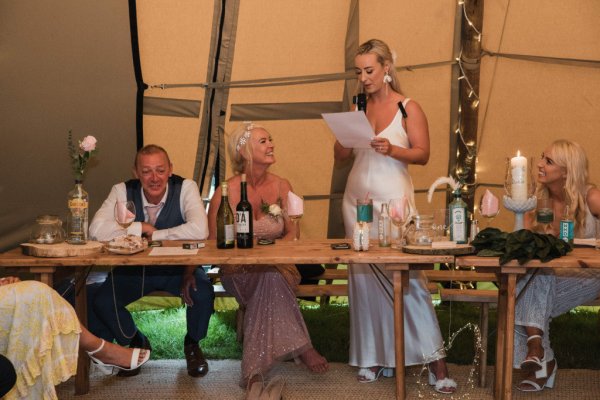 Bride giving speech at table