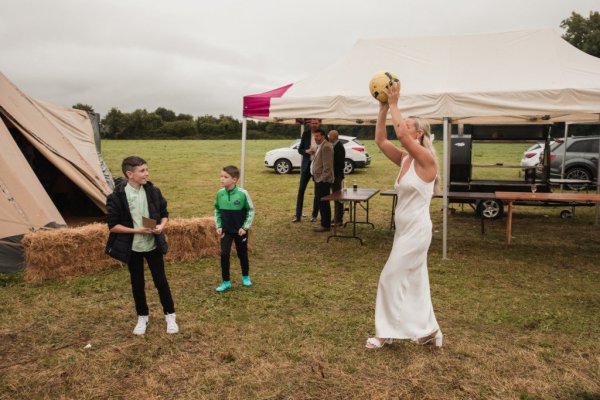 Bride playing with children