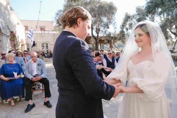 Bride and groom Greece priest officiant and guests