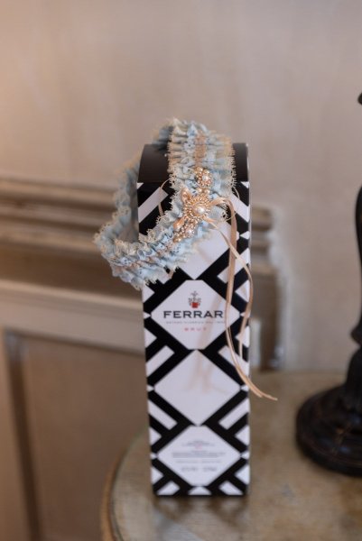 Garter hanging on Ferrari perfume bottle