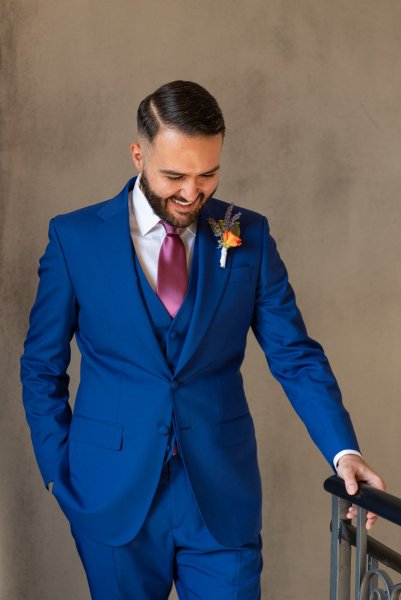 Groom smiling looking down