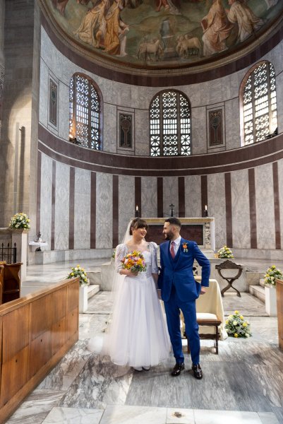 Bride and groom walk down aisle after wedding