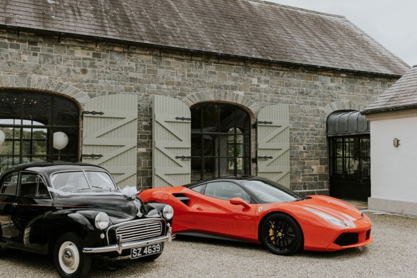 Red sports car black wedding car with ribbon