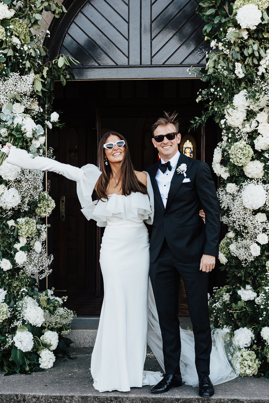 bride and groom wearing sunglasses