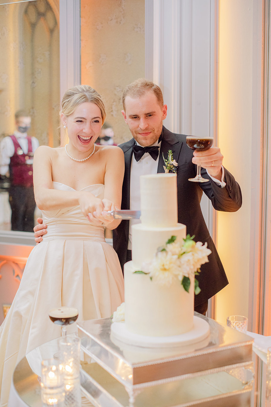 bride and groom cutting cake