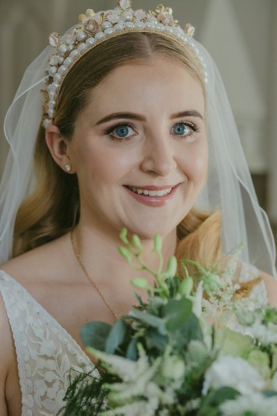 Bride exterior shot bouquet flowers garden close up