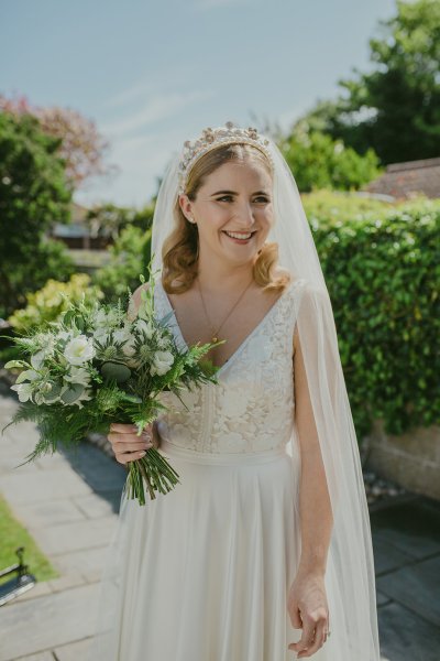 Bride exterior shot bouquet flowers