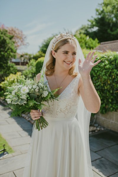 Bride exterior shot bouquet flowers