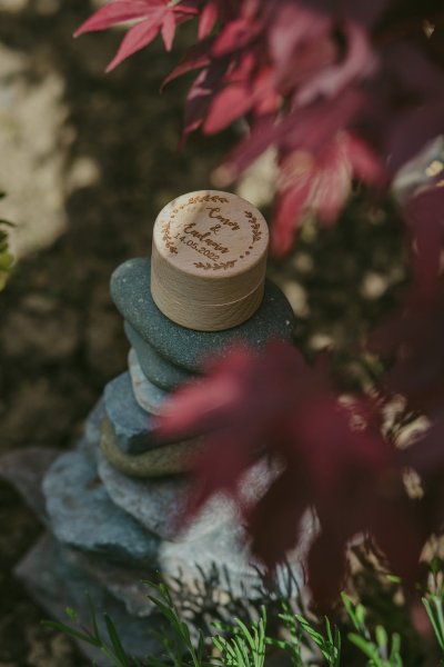 Wedding ring/band box sitting on rocks