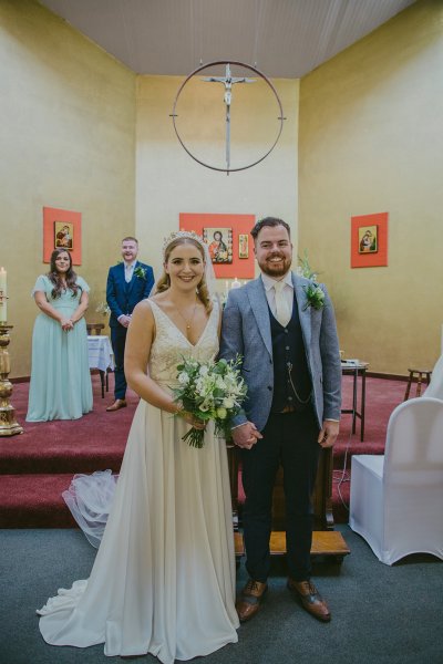 Bride and groom at church alter just wed