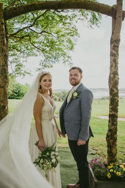 bride and groom on grass