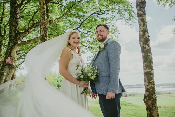 bride and groom on grass