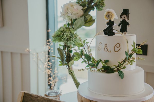 S & C white wedding cake and flowers