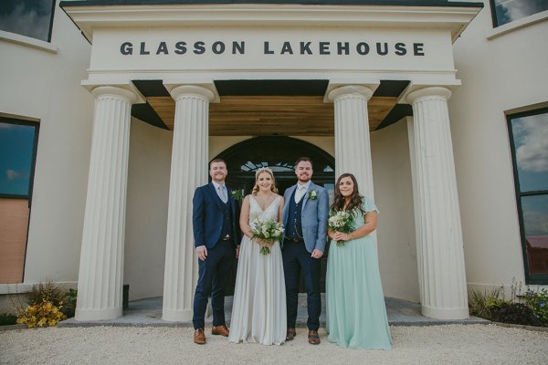 Bride groom Best Man and bridesmaid outside of Glasson Lakehouse