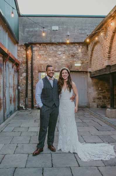 Lights in background couple bride and groom