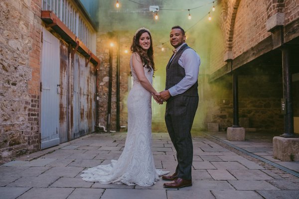 Lights in background couple bride and groom