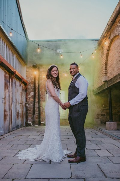 Lights in background couple bride and groom