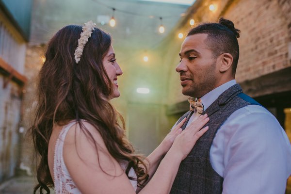 Lights in background couple bride and groom