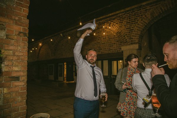 Man outside with glass of wine in hand