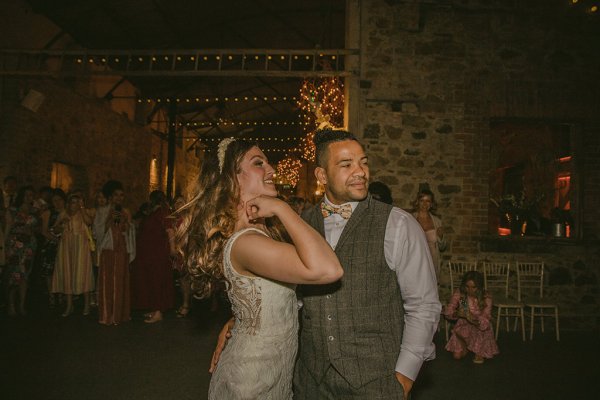 Groom and bride dance on dancefloor