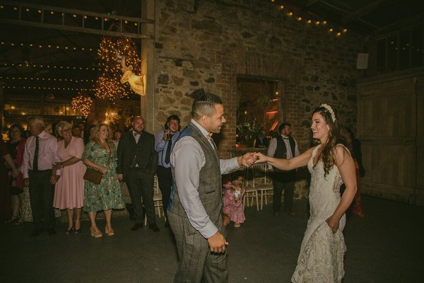 Groom and bride dance on dancefloor