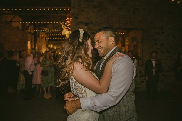 Groom and bride dance on dancefloor