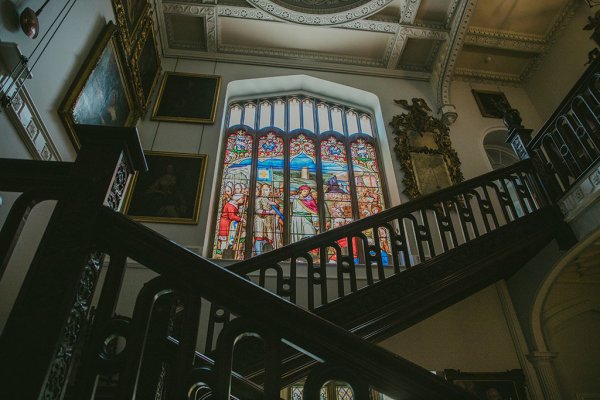 Interior church tinted windows and wooden staircase detail