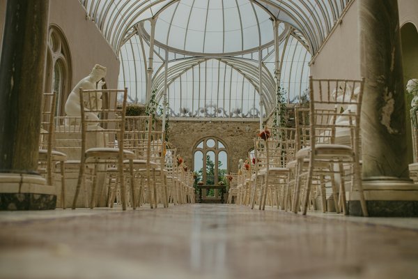 Floor POV of ceremonial interior white chair room setting