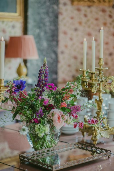 Close up of purple and pink flowers candles