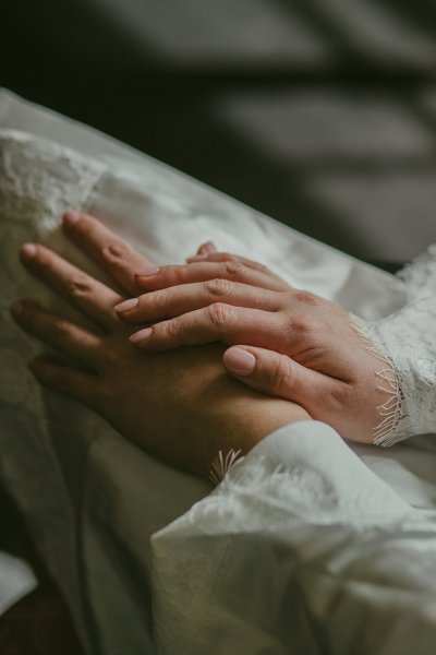 Brides hands placed on lap