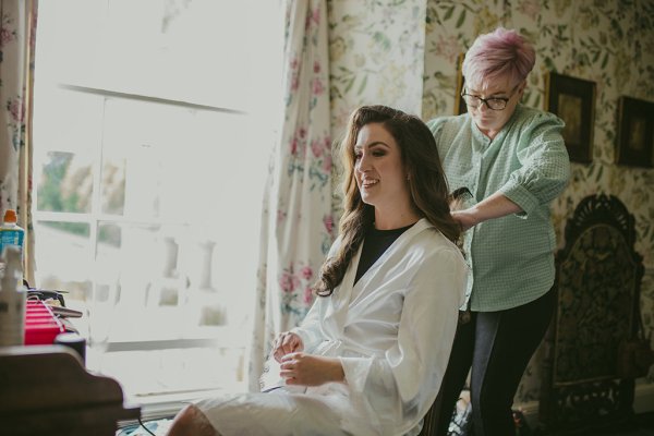 Bride getting hair done hairspray