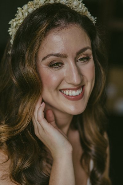 Bride smiling hair and makeup detail